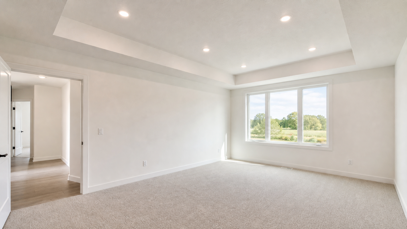 Finished interior room with smooth drywall walls